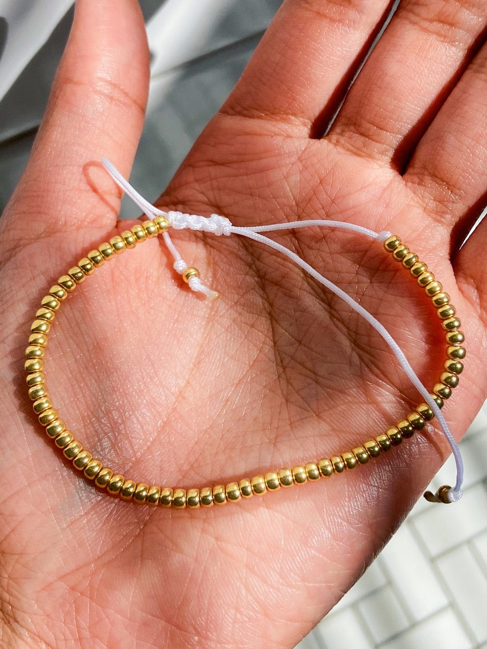 adjustable string gold beaded bracelet