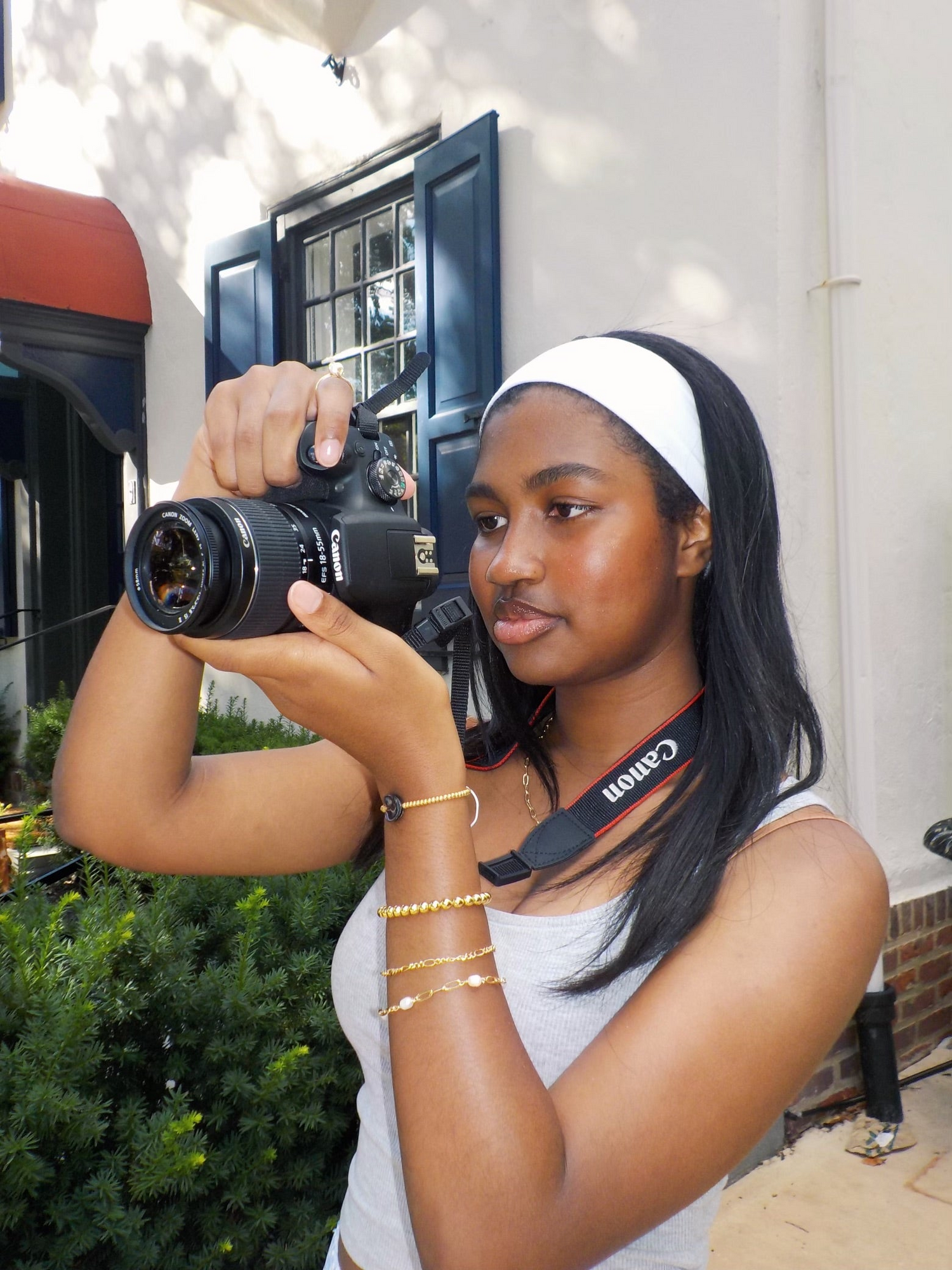 Girl wearing unique 18k gold plated jewelry from madebyzoe while taking a photo