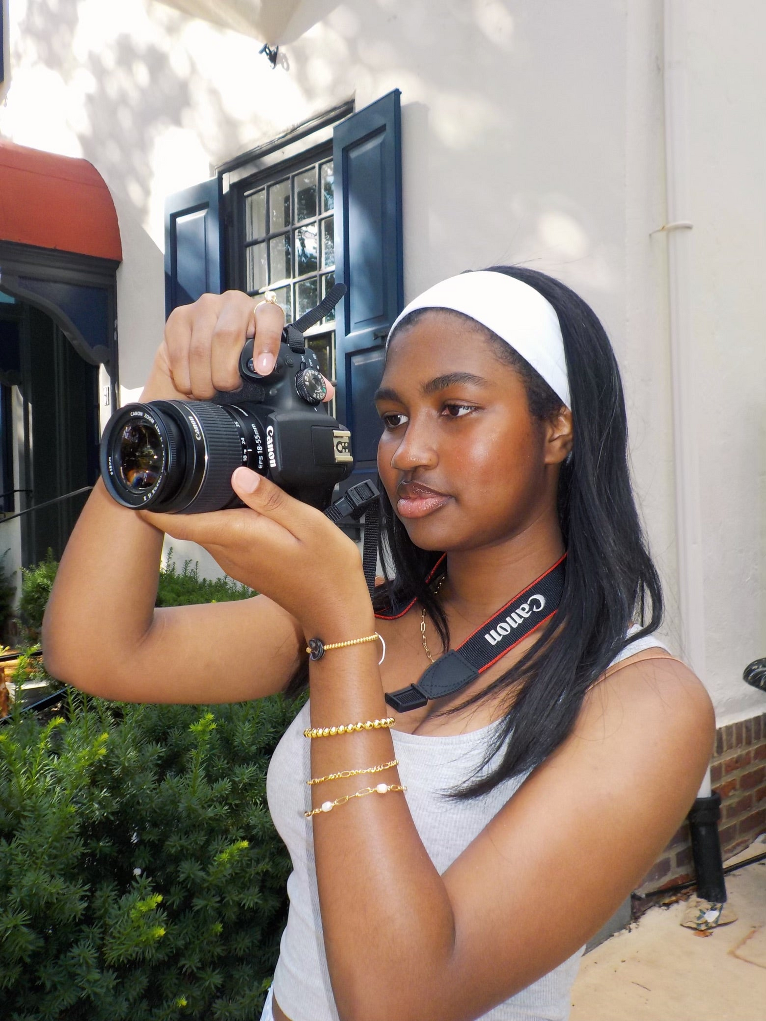 Girl wearing unique 18k gold plated jewelry from madebyzoe while taking a photo 